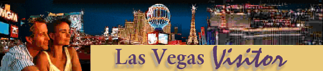 A couple in LV at night w/ lighted hotels behind